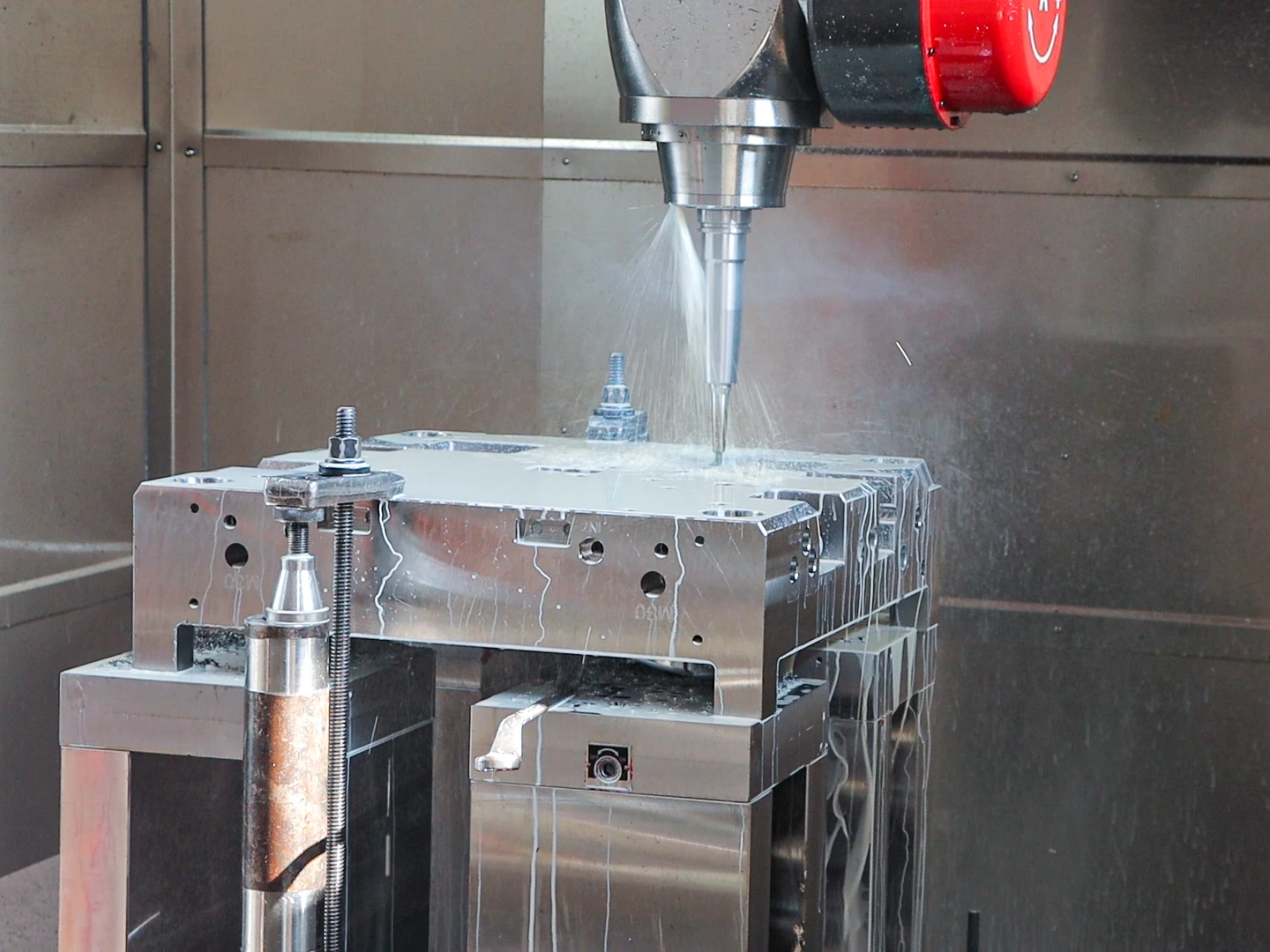 Close-Up of Coolant-Assisted CNC Milling on Mold Steel Workpiece